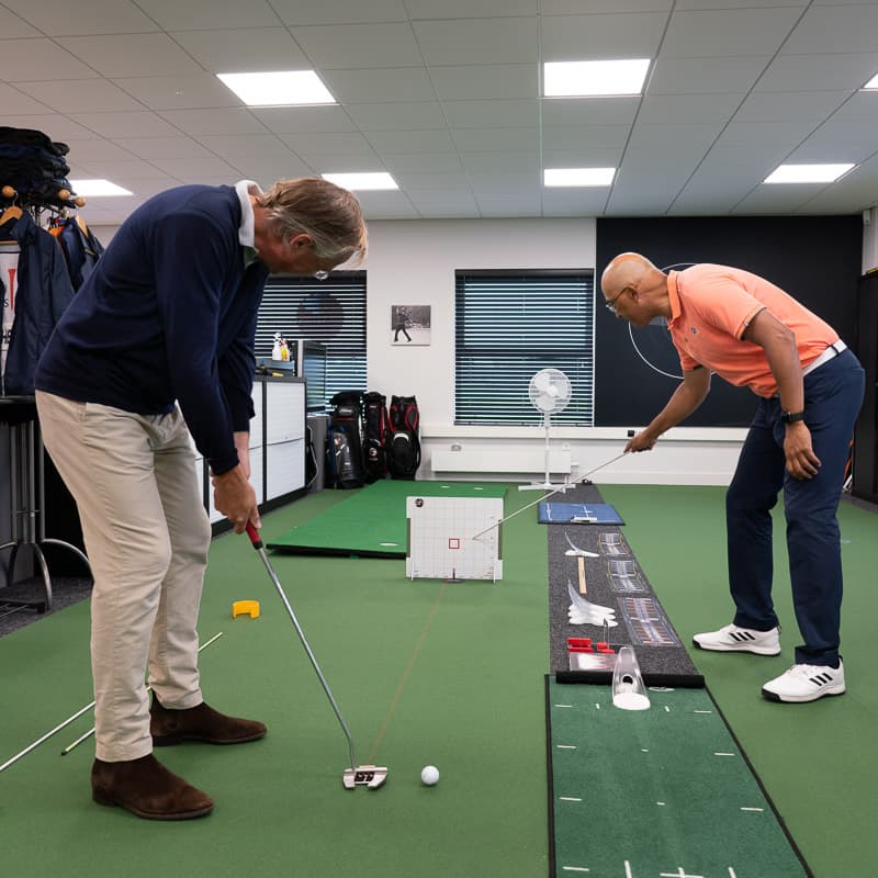 Raymond coaches a player in the studio