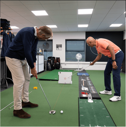 Player and coach check alignment during the laser test